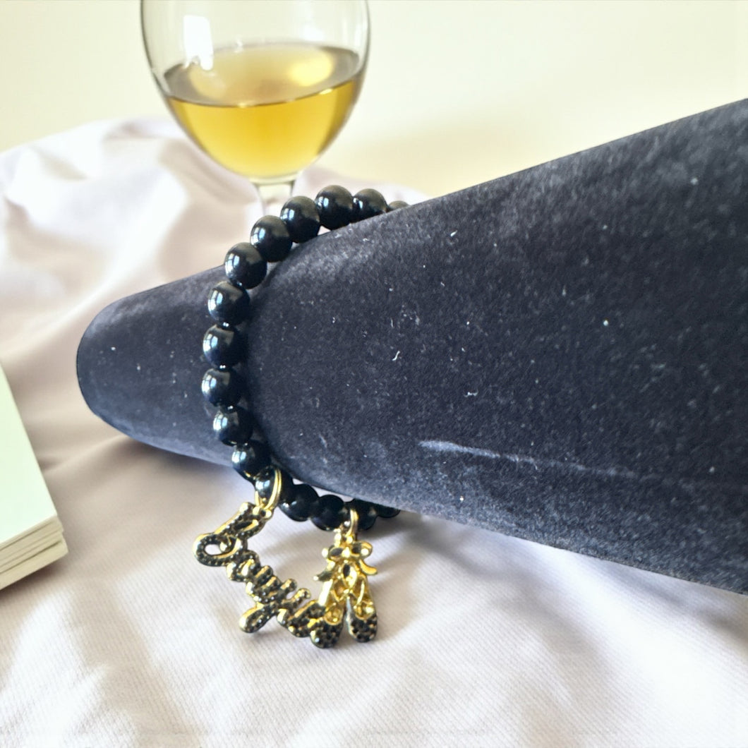 8mm Black Beaded Bracelet with Boujie and Shoes Charms