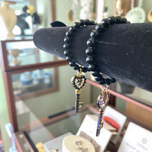 Load image into Gallery viewer, 8mm Black Beaded Bracelet with Large Key Charm
