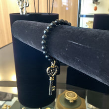 Load image into Gallery viewer, 8mm Black Beaded Bracelet with Large Key Charm
