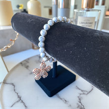 Load image into Gallery viewer, 8mm White/Gray Beaded Bracelet with a Flower Charm
