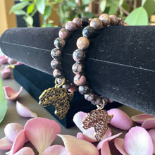 Load image into Gallery viewer, 8mm Black/Pink Beaded Bracelet with The Shape of Africa Charm
