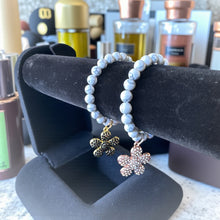 Load image into Gallery viewer, 8mm White/Gray Beaded Bracelet with a Flower Charm
